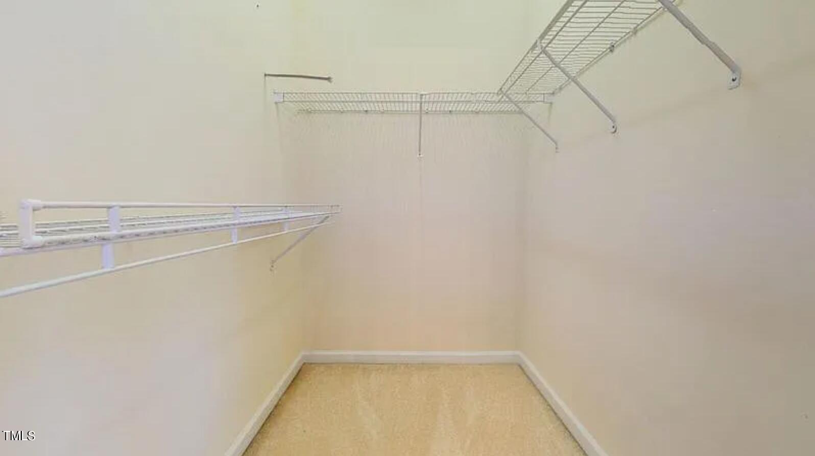 2604 Crofton Springs Drive Raleigh, NC 27615 - Photo 16 of 21 a view of a room with racks on the wall