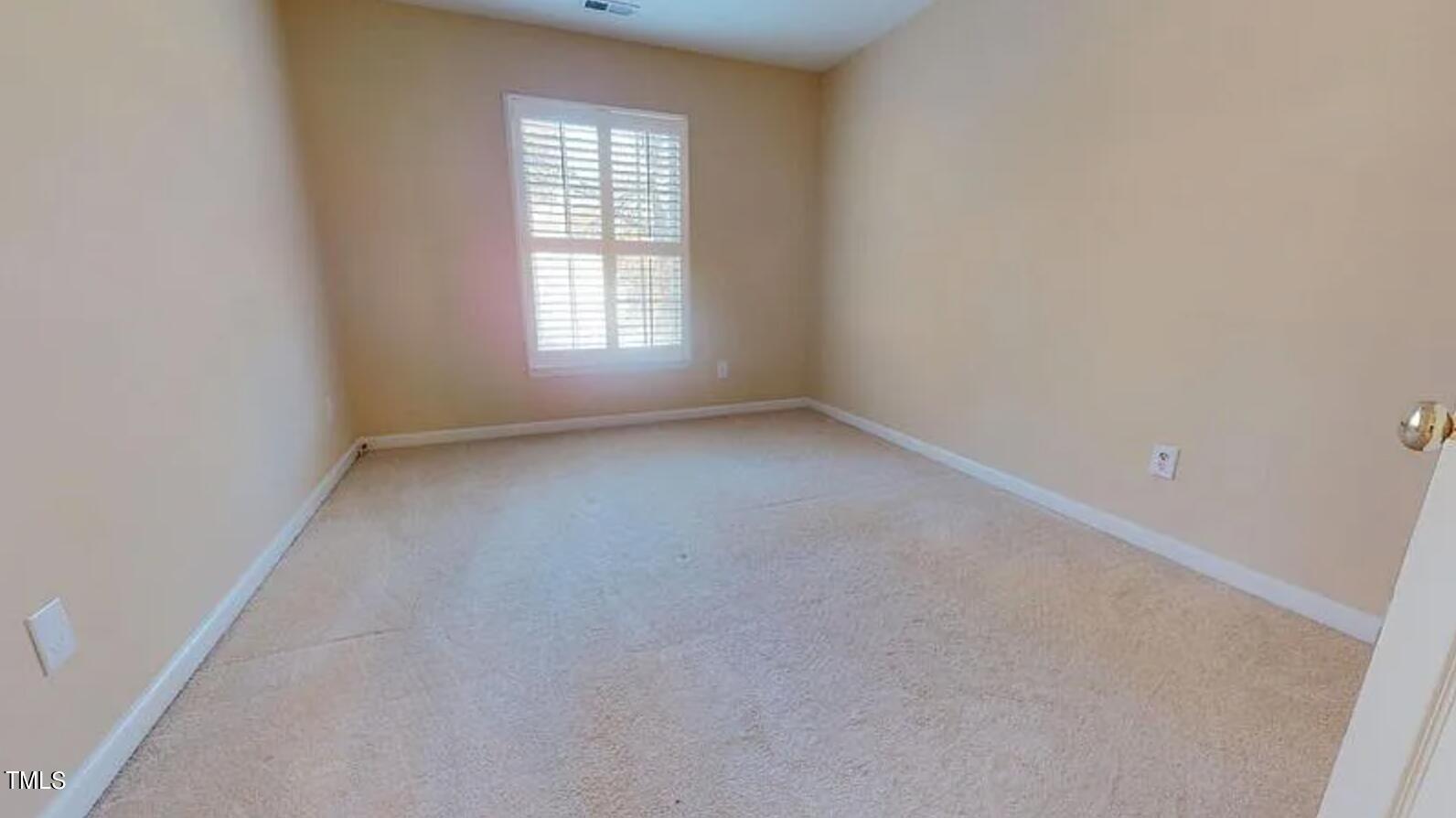 2604 Crofton Springs Drive Raleigh, NC 27615 - Photo 19 of 21 an empty room with a window