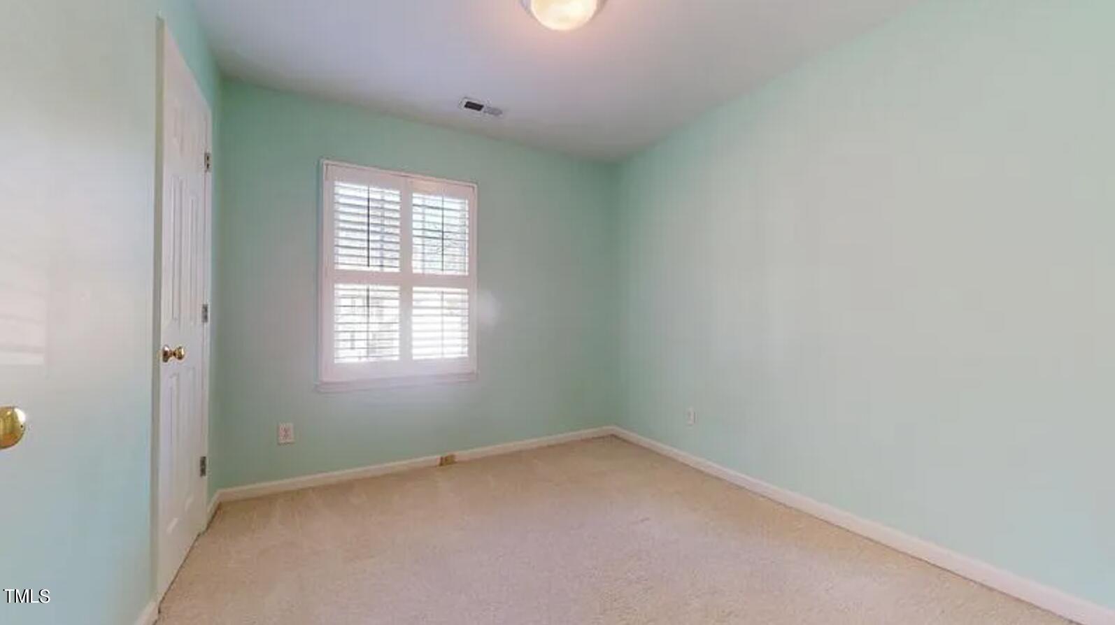 2604 Crofton Springs Drive Raleigh, NC 27615 - Photo 20 of 21 an empty room with a window