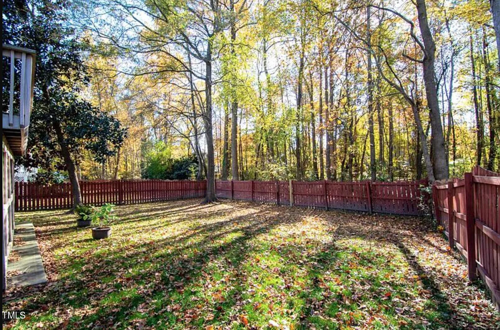 2604 Crofton Springs Drive Raleigh, NC 27615 - Photo 2 of 21 a view of a backyard with large trees