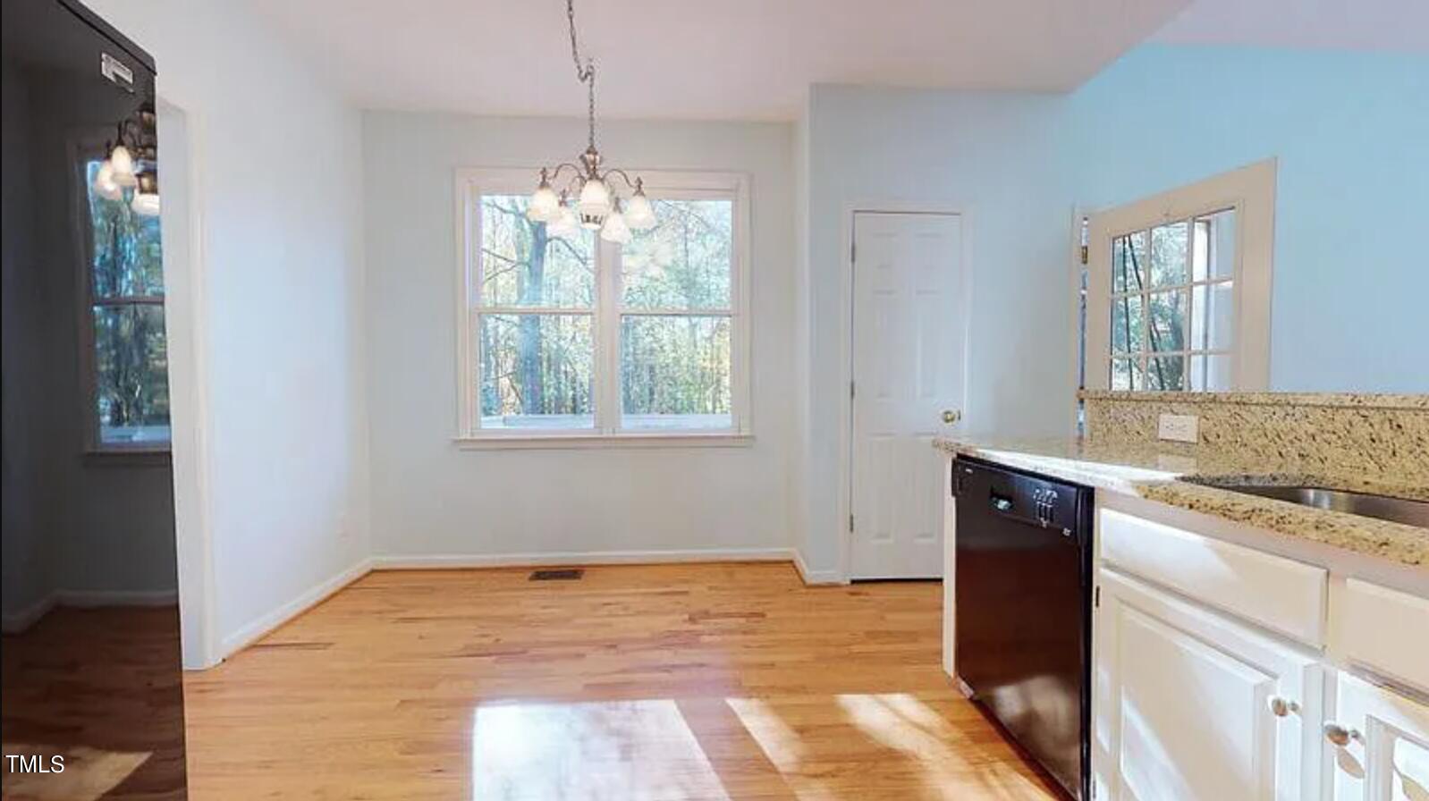 2604 Crofton Springs Drive Raleigh, NC 27615 - Photo 8 of 21 a kitchen with stainless steel appliances granite countertop a stove a sink and a window