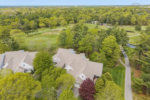 an aerial view of a house with yard swimming pool and outdoor seating