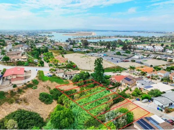 an aerial view of residential building and lake