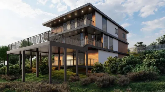 a front view of white house with a yard