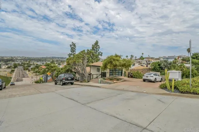 an outdoor space with view of city