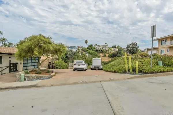 a view of a house with a street