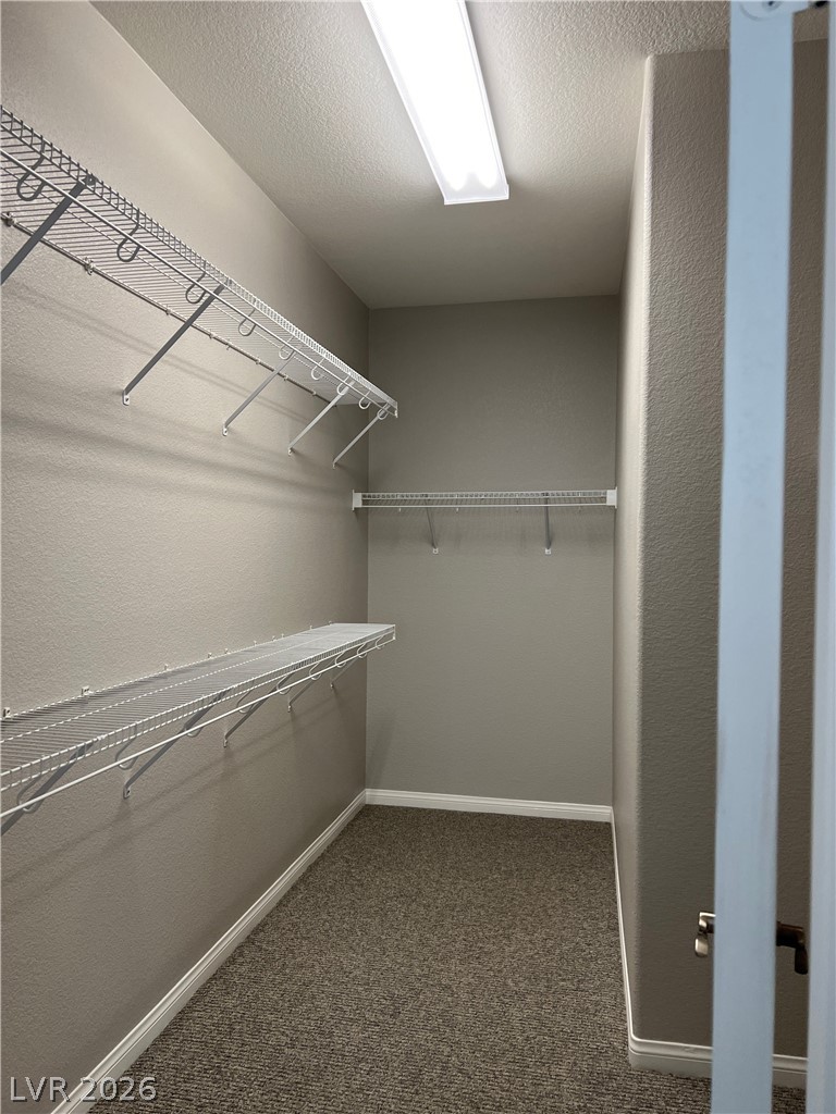 5981 Honeysuckle Ridge Street Las Vegas, NV 89148 - Photo 24 of 29 A well-lit closet with ample wire shelving offers organized storage solutions.