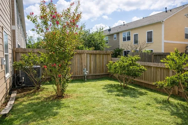a backyard of a house with lots of green space