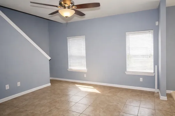 a view of an empty room with a window