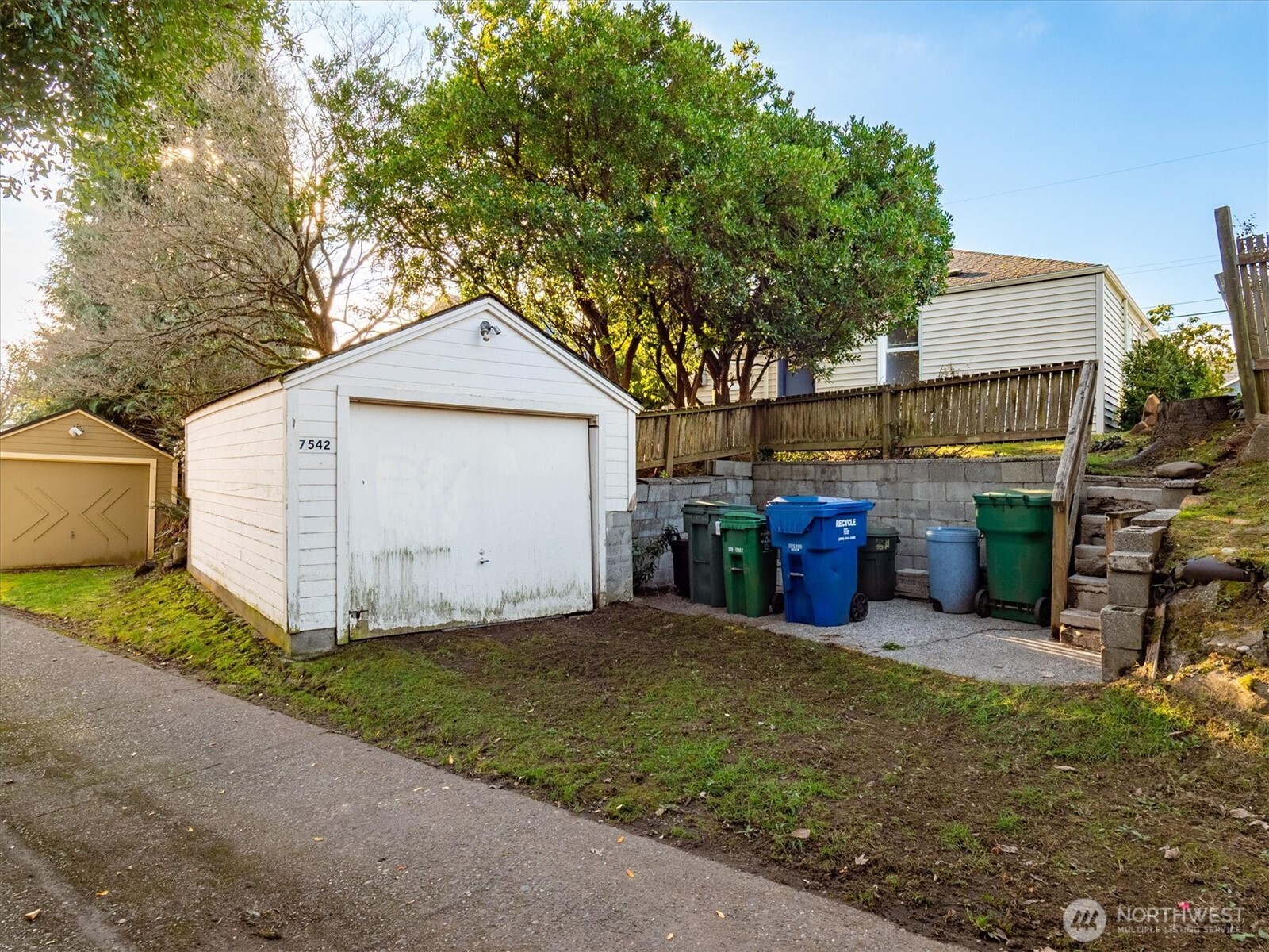 7542 9th Avenue Northwest Seattle, WA 98117 - Photo 20 of 26 a view of a house with a yard and large tree