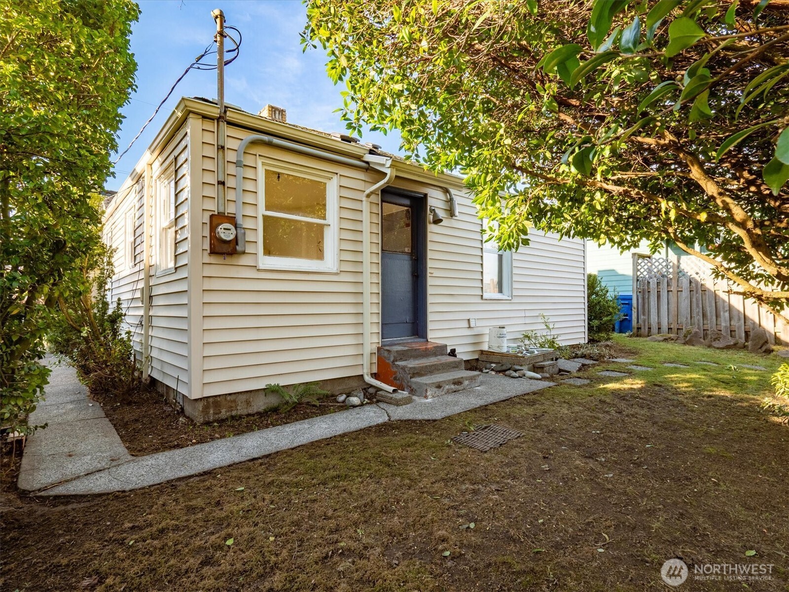 7542 9th Avenue Northwest Seattle, WA 98117 - Photo 23 of 26 a view of a house with a yard
