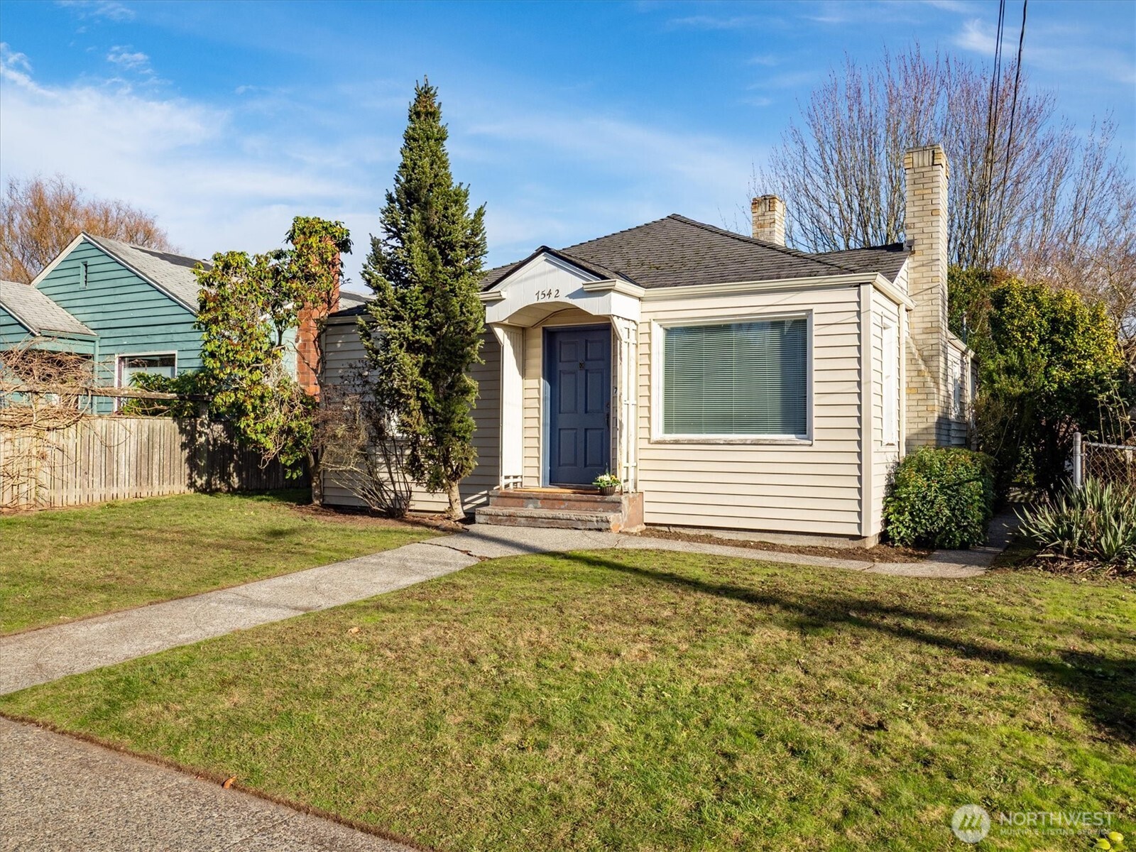 7542 9th Avenue Northwest Seattle, WA 98117 - Photo 25 of 26 a front view of a house with a yard