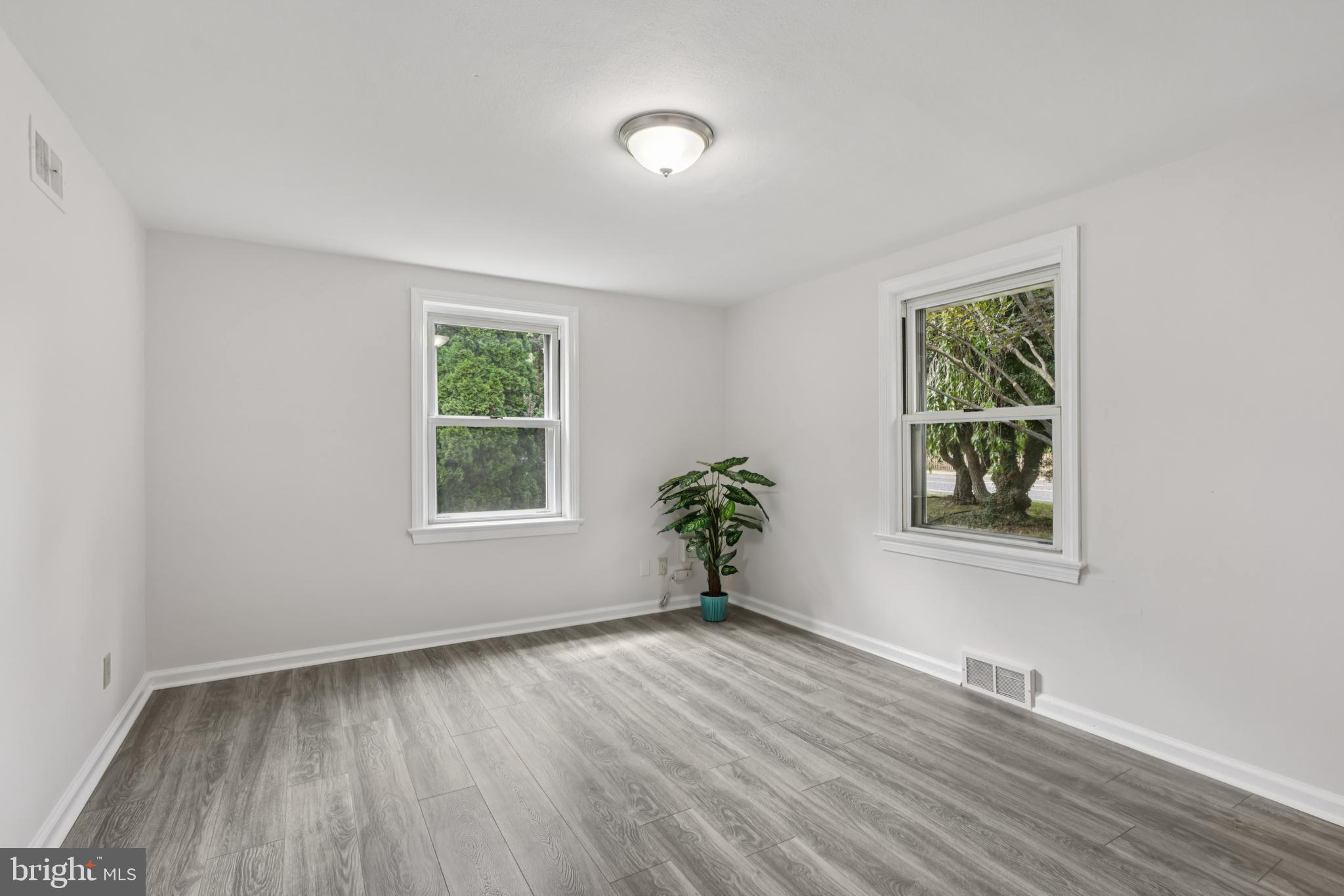 35 Wallace Road Princeton Junction, NJ 08550 - Photo 17 of 34 a view of an empty room with wooden floor and a window