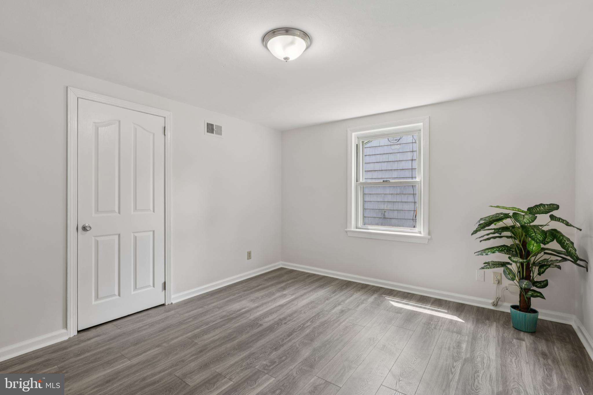 35 Wallace Road Princeton Junction, NJ 08550 - Photo 18 of 34 an empty room with wooden floor and windows