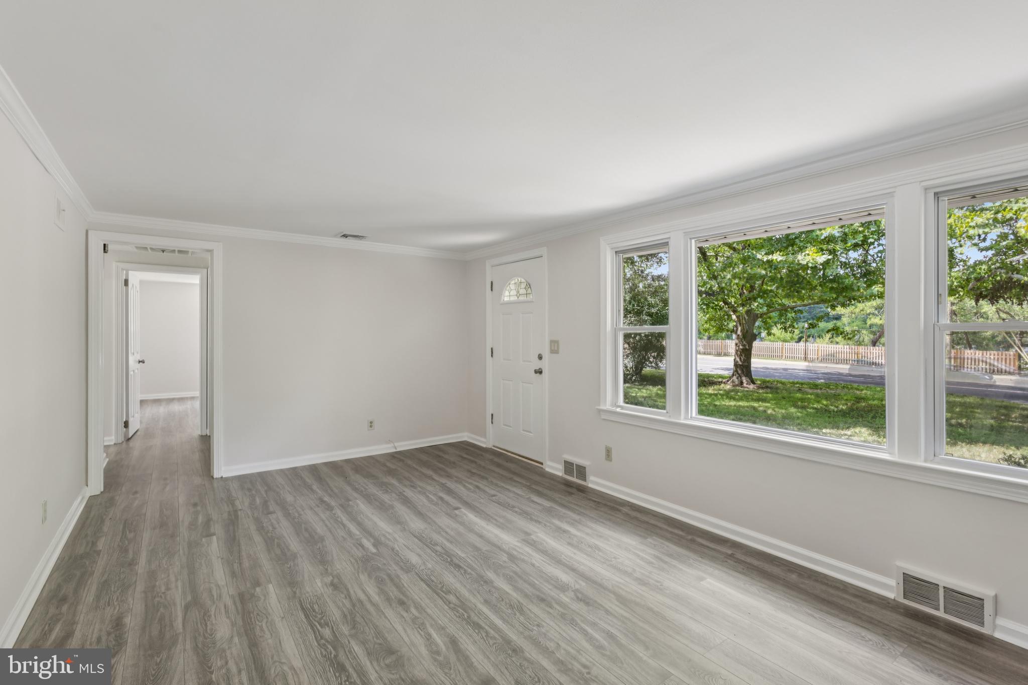 35 Wallace Road Princeton Junction, NJ 08550 - Photo 5 of 34 a view of an empty room with wooden floor and a window