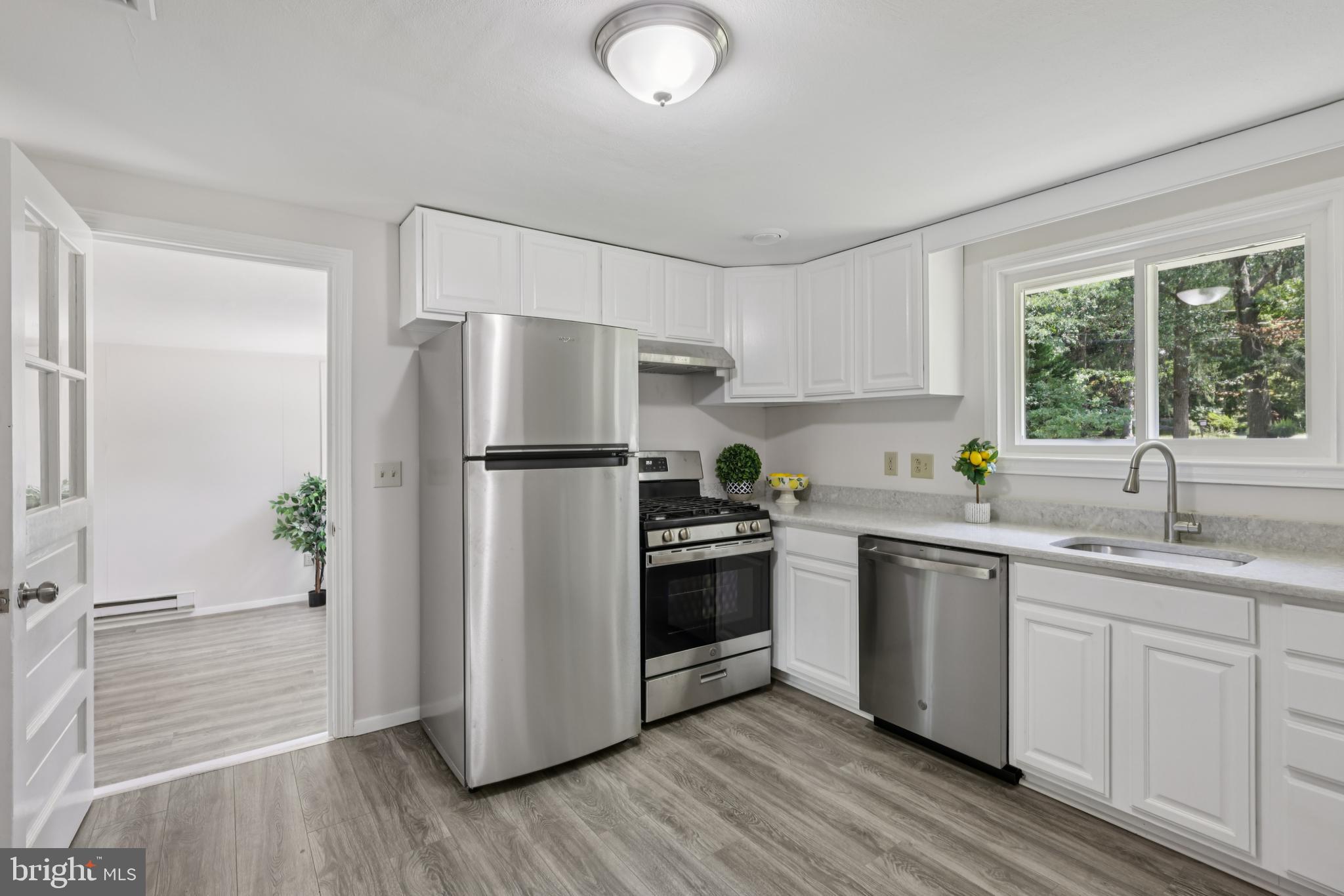 35 Wallace Road Princeton Junction, NJ 08550 - Photo 9 of 34 a kitchen with stainless steel appliances a refrigerator sink and microwave