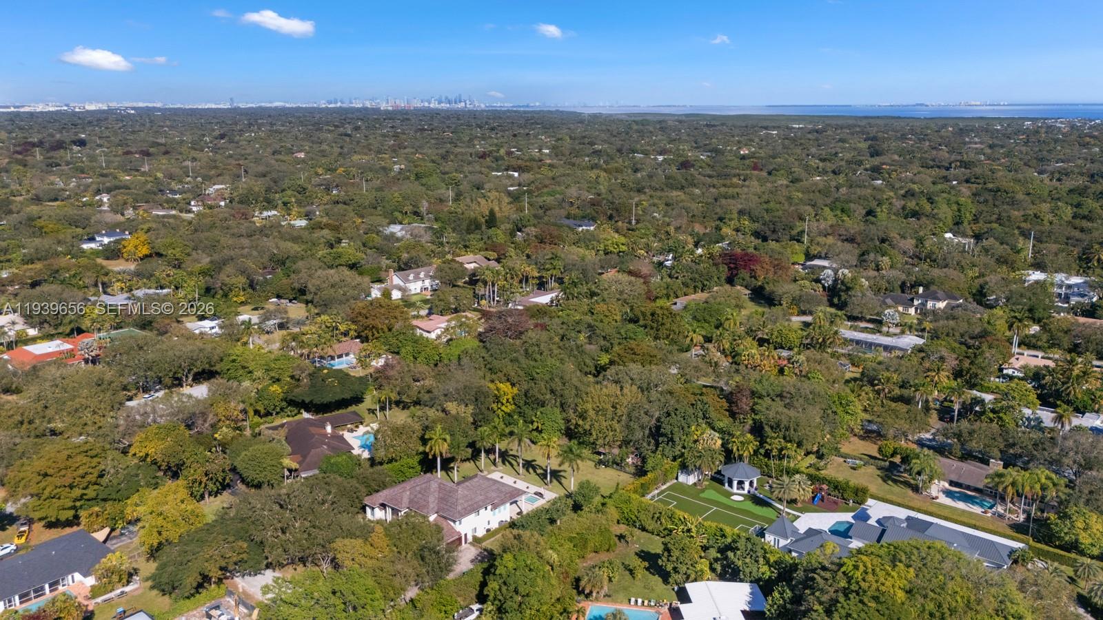 13500 Southwest 68th Court Pinecrest, FL 33156 - Photo 17 of 21 an aerial view of residential houses with outdoor space and trees