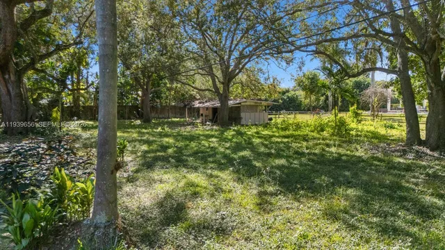 a backyard of a house with lots of green space