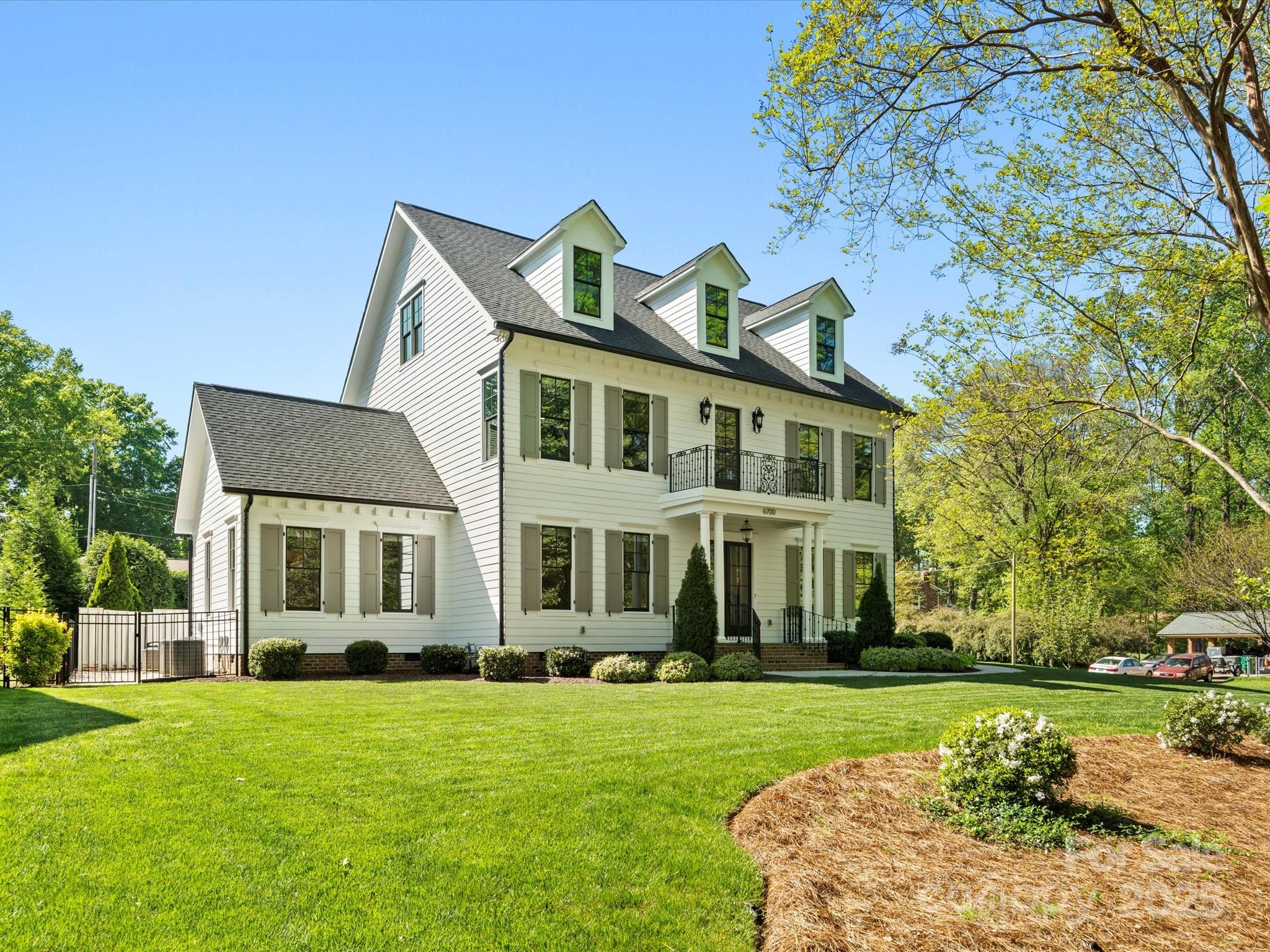 6700 Folger Drive Charlotte, NC 28270 - Photo 1 of 48 a front view of a house with a yard