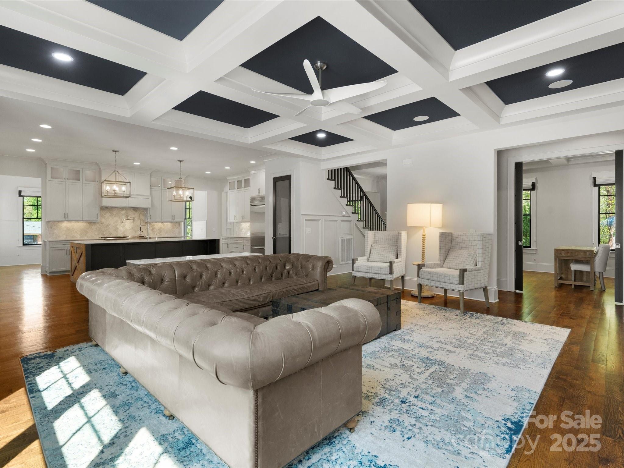 6700 Folger Drive Charlotte, NC 28270 - Photo 16 of 48 a living room with couches and kitchen view with wooden floor