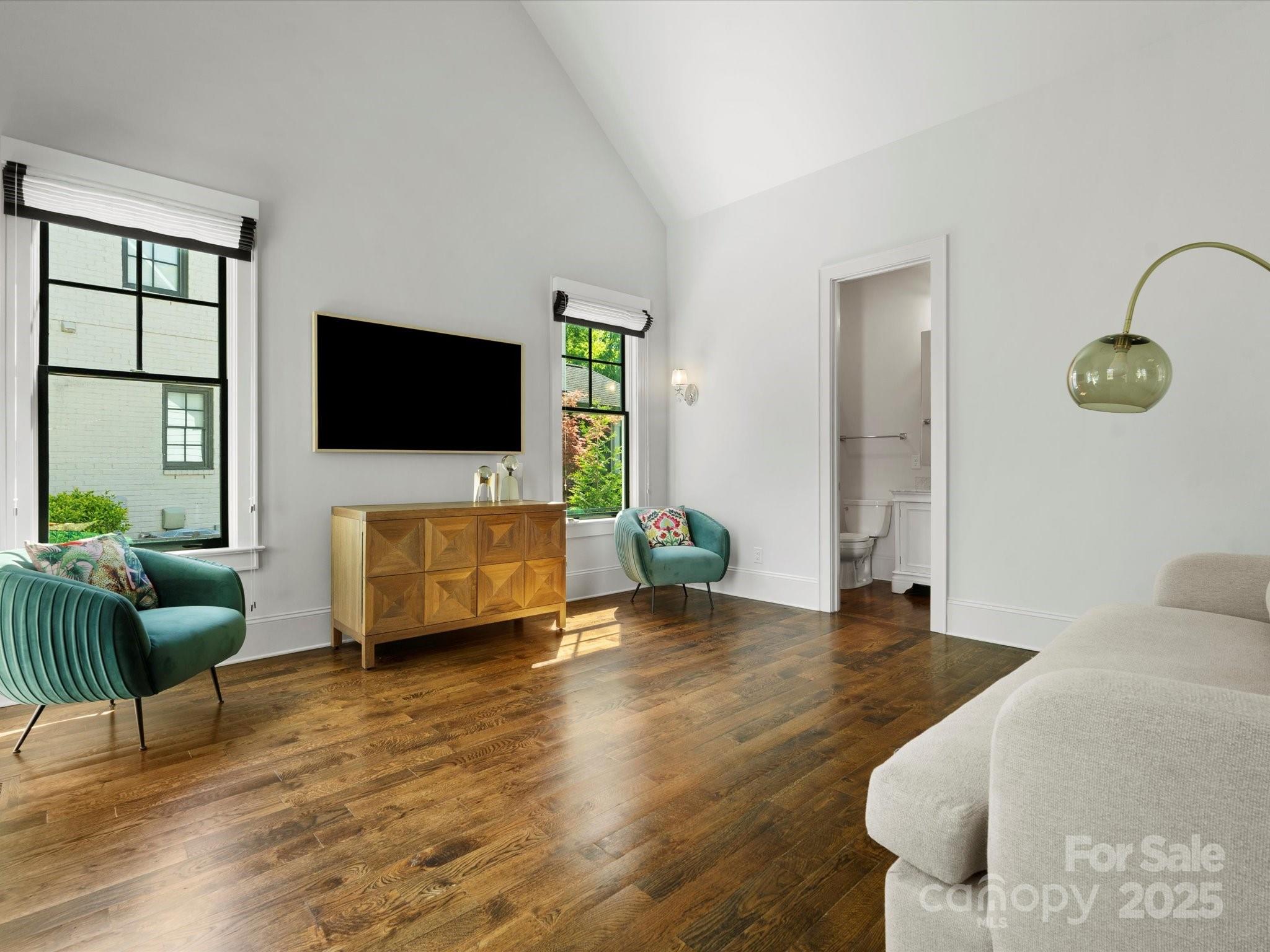 6700 Folger Drive Charlotte, NC 28270 - Photo 19 of 48 a living room with furniture and a flat screen tv
