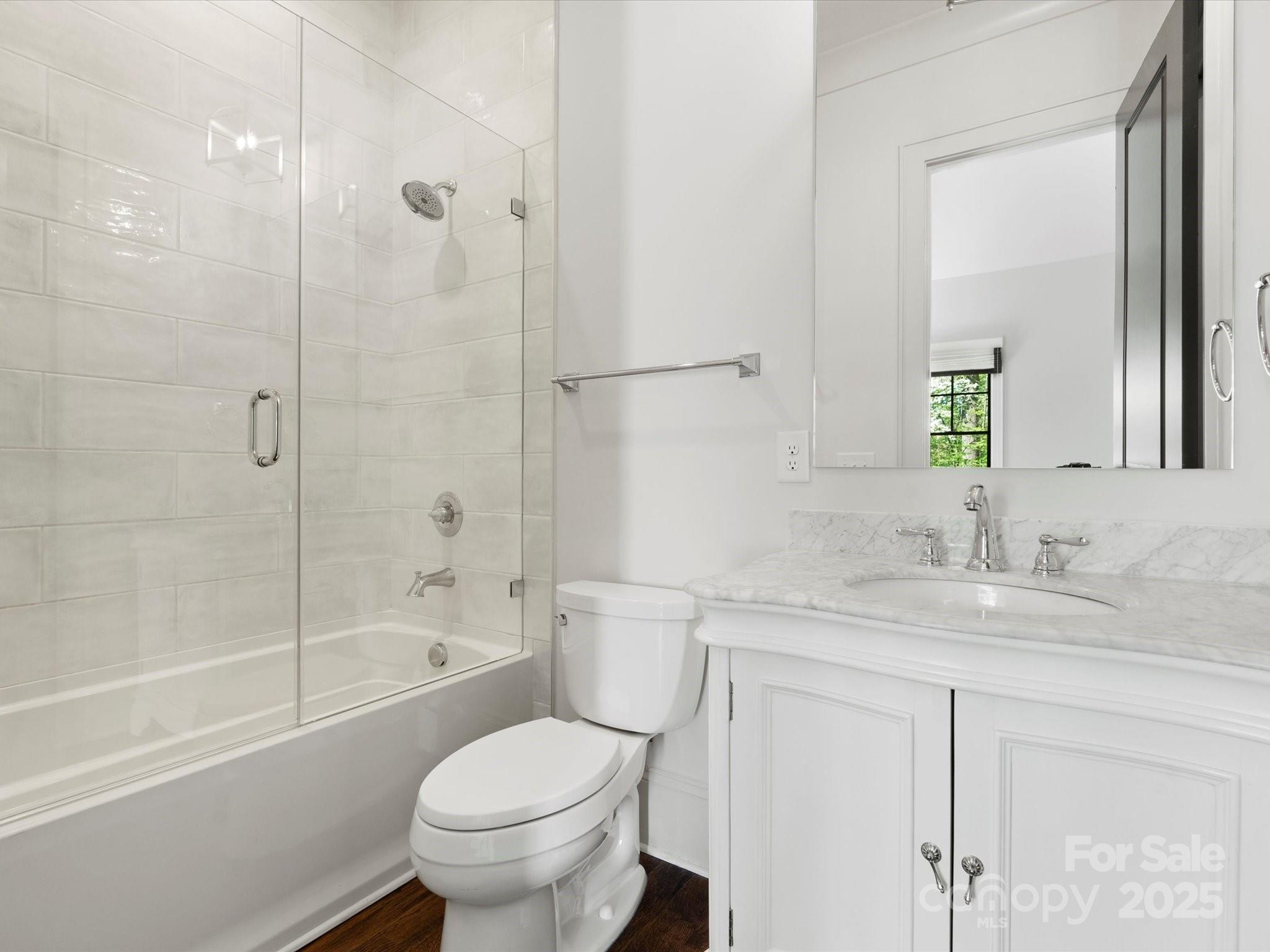 6700 Folger Drive Charlotte, NC 28270 - Photo 20 of 48 a bathroom with a granite countertop toilet a sink and a bathtub