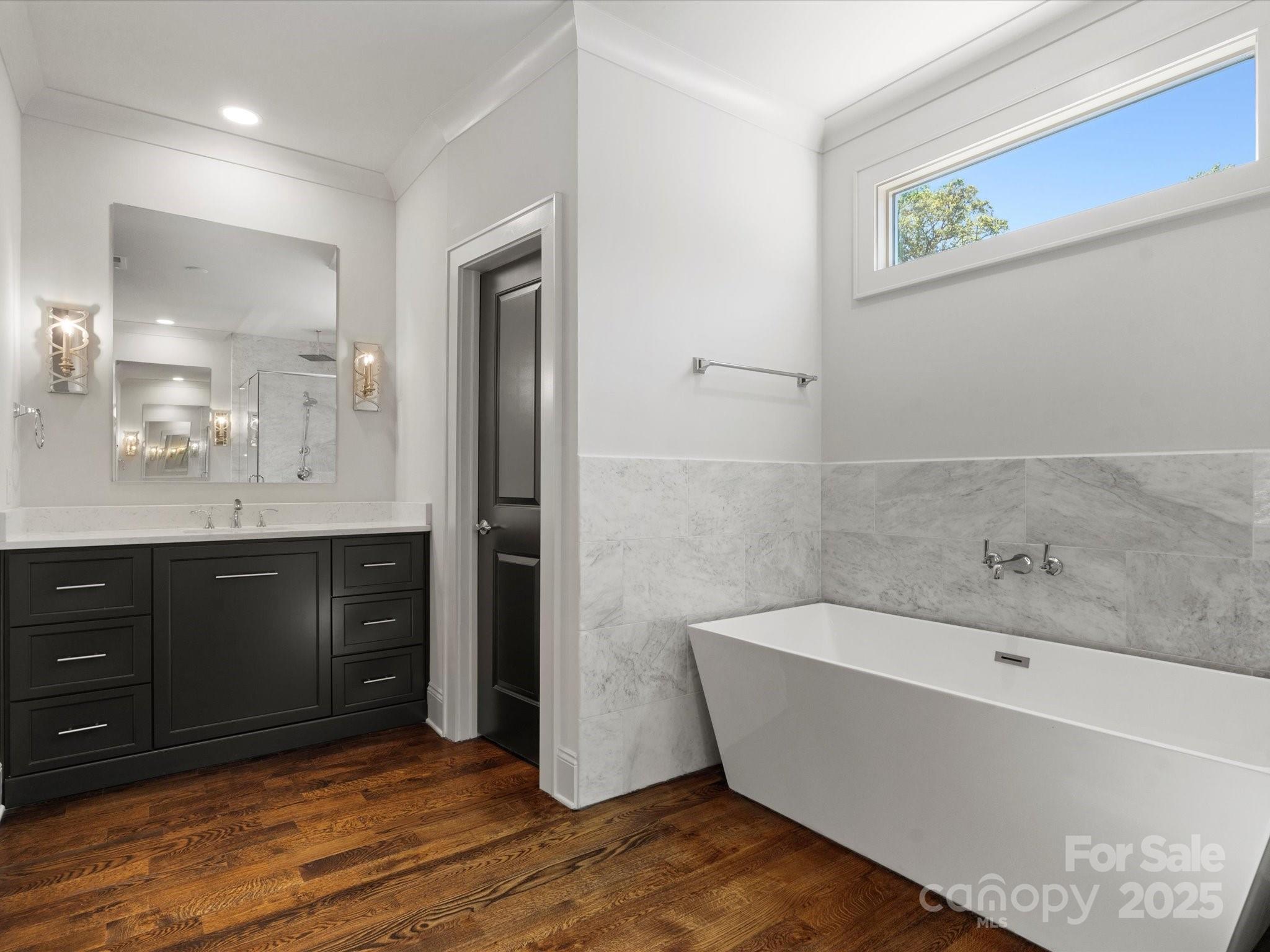 6700 Folger Drive Charlotte, NC 28270 - Photo 25 of 48 a bathroom with a bathtub and a sink