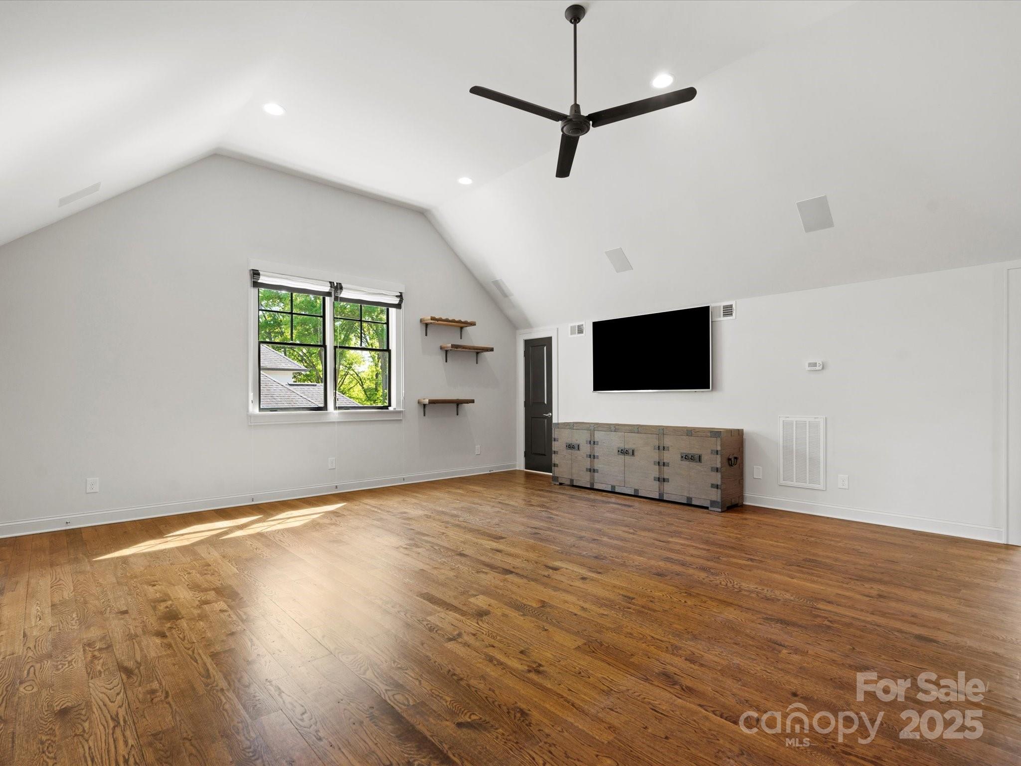 6700 Folger Drive Charlotte, NC 28270 - Photo 32 of 48 a view of an empty room with wooden floor and a window