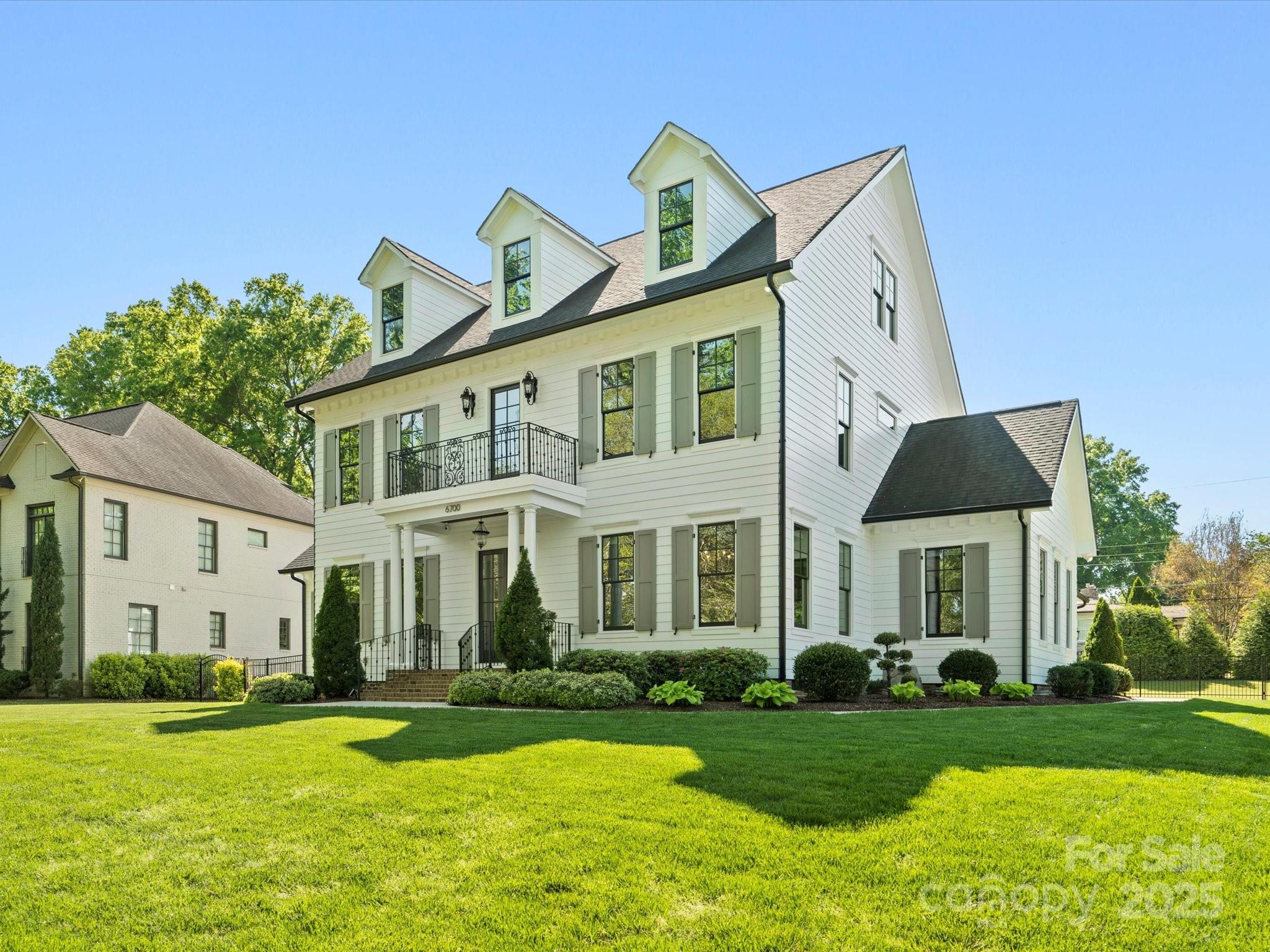 6700 Folger Drive Charlotte, NC 28270 - Photo 47 of 48 a front view of a house with a yard