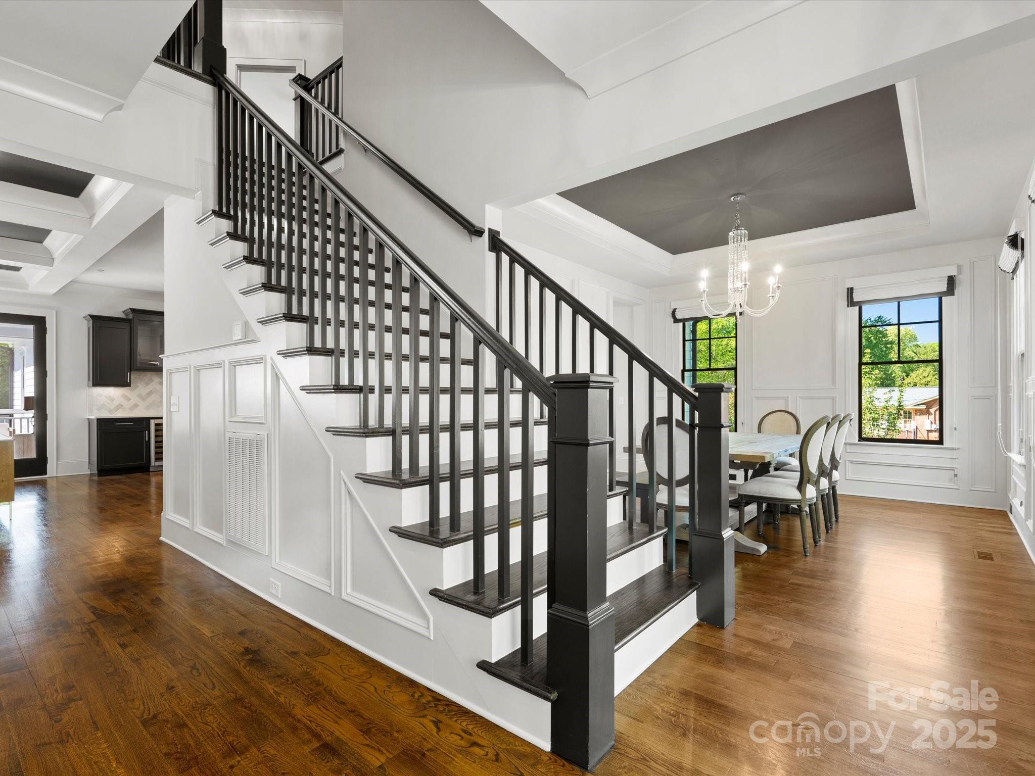 6700 Folger Drive Charlotte, NC 28270 - Photo 6 of 48 a view of entryway livingroom and hall with wooden floor