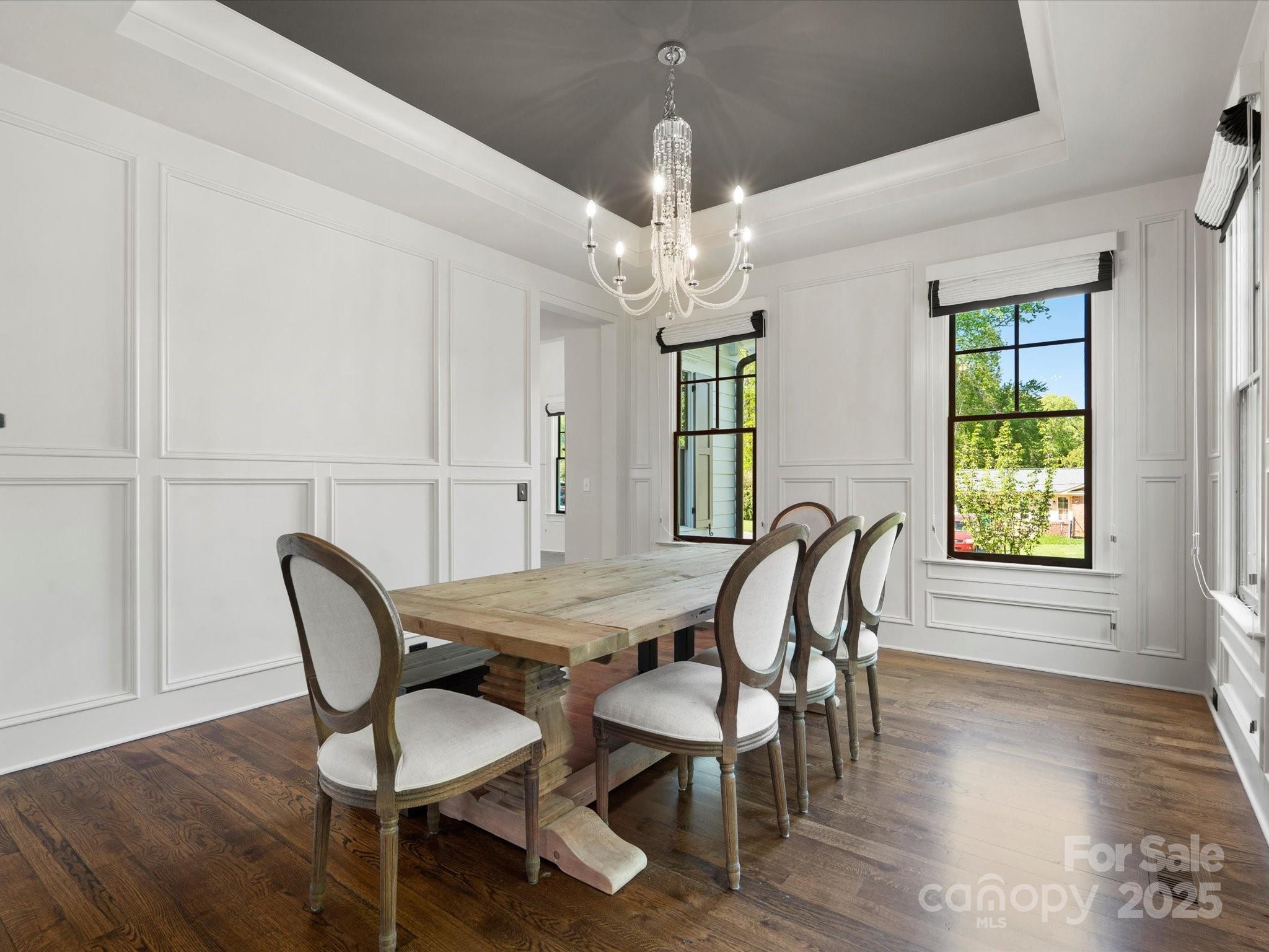 6700 Folger Drive Charlotte, NC 28270 - Photo 7 of 48 a view of a dining room with furniture and wooden floor