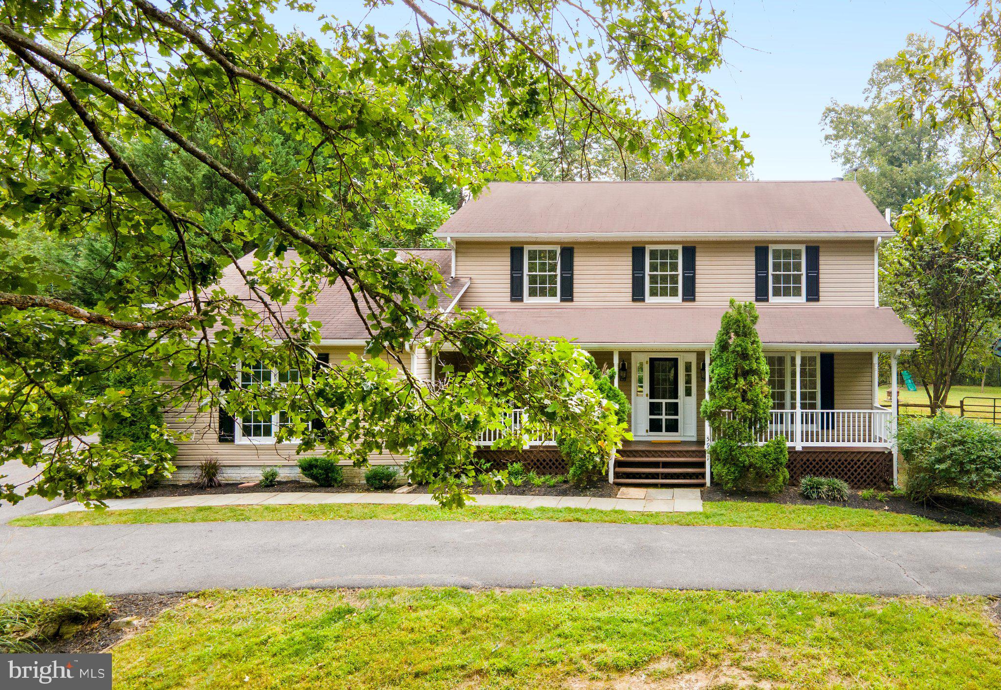 5901 Moore Road Marshall, VA 20115 - Photo 2 of 47 Home is surrounded by mature trees & landscaping.