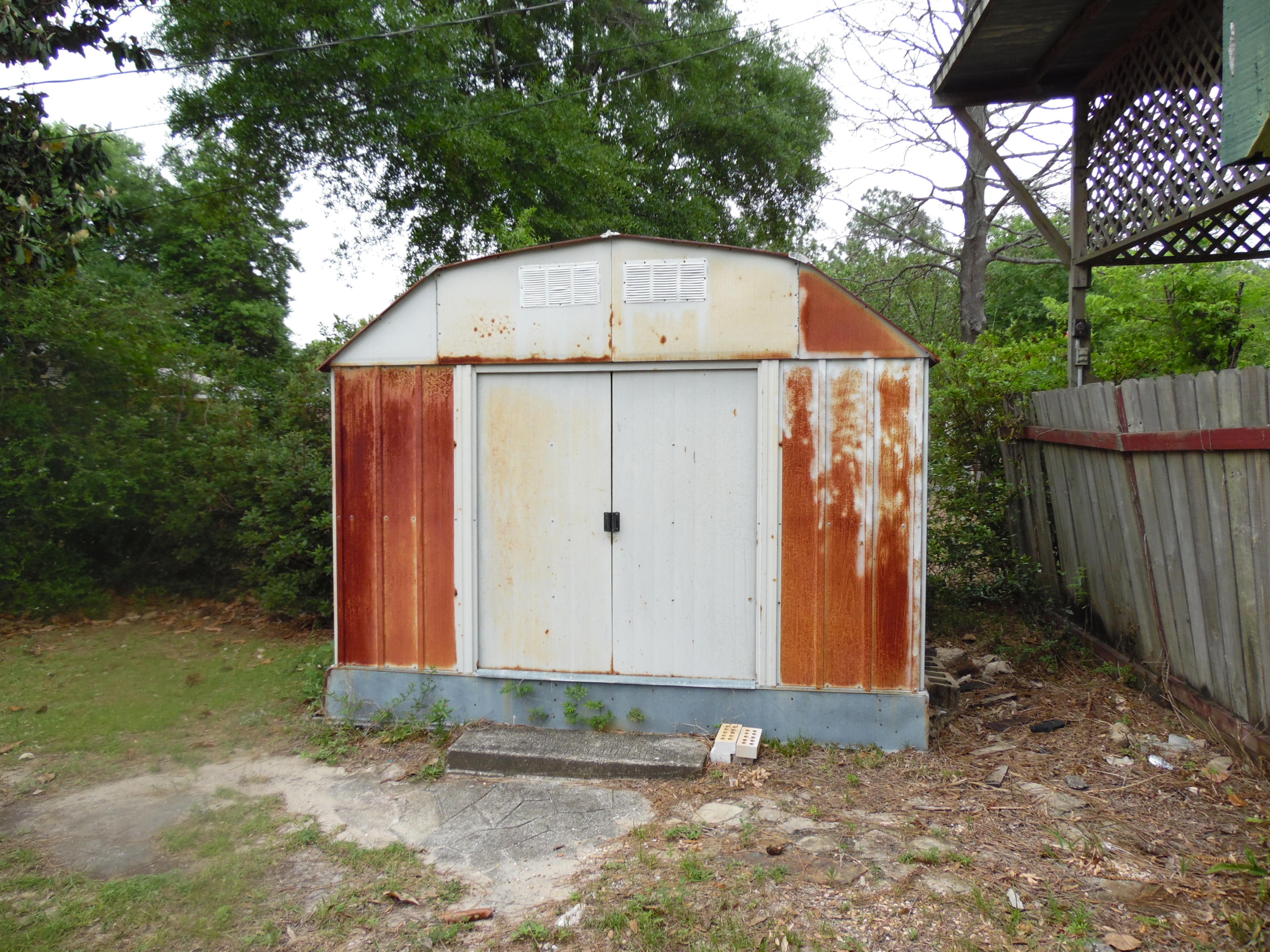 365 Vanderheide Road DeFuniak Springs, FL 32433 - Photo 31 of 34 Storage shed in front yard by carports