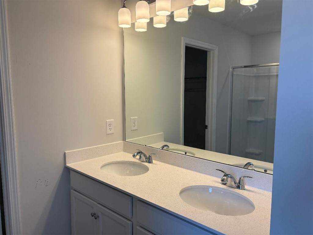 129 Cedar Shoals Easley, SC 29640 - Photo 18 of 31 A well-lit primary bathroom features a large vanity with dual sinks and ample counter space.