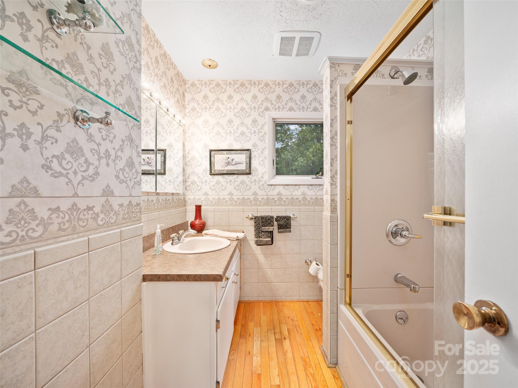 59 Deer Place Road Spruce Pine, NC 28777 - Photo 12 of 40 a bathroom with a tub sink and mirror