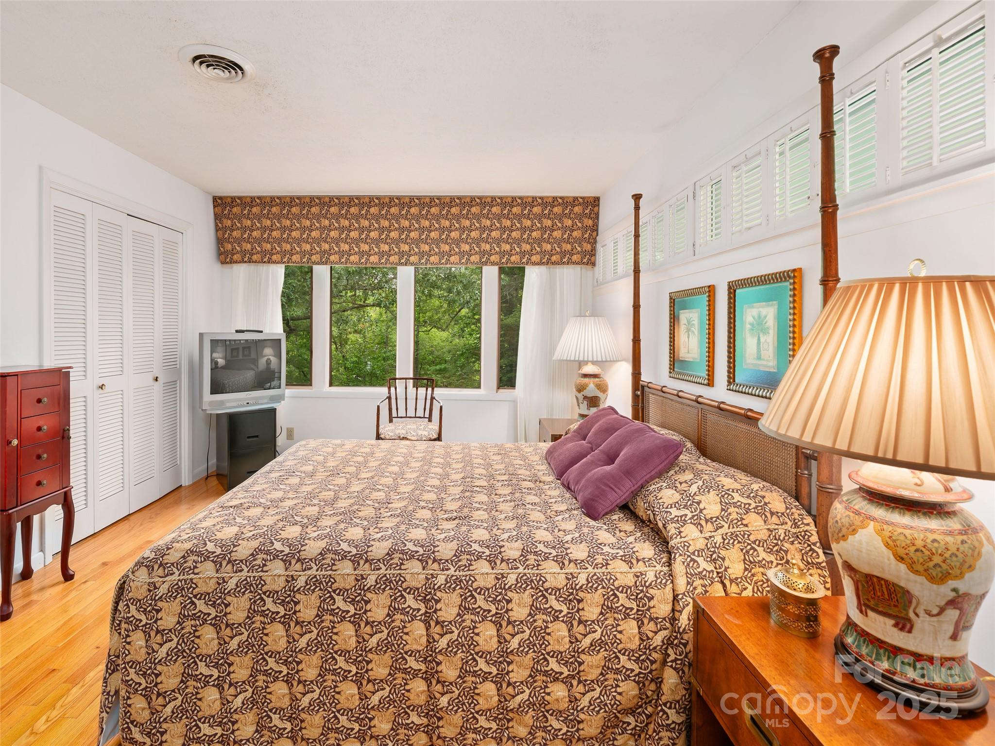 59 Deer Place Road Spruce Pine, NC 28777 - Photo 16 of 40 a bed sitting in a bedroom next to a window