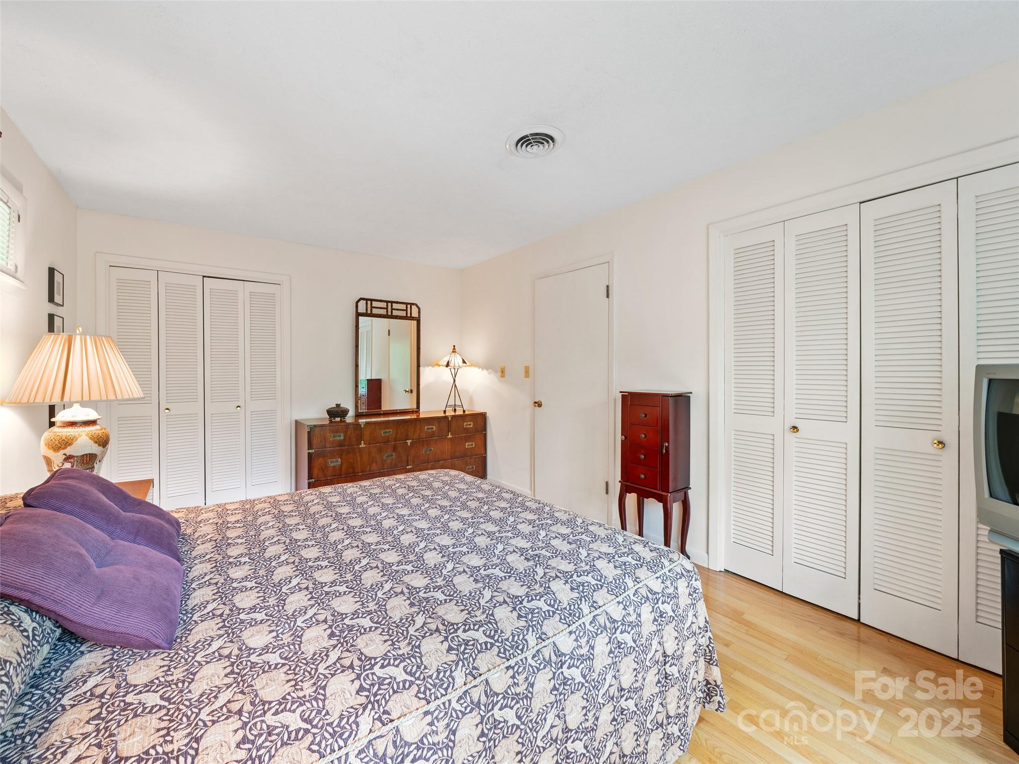 59 Deer Place Road Spruce Pine, NC 28777 - Photo 17 of 40 a bedroom with a large bed and a dresser