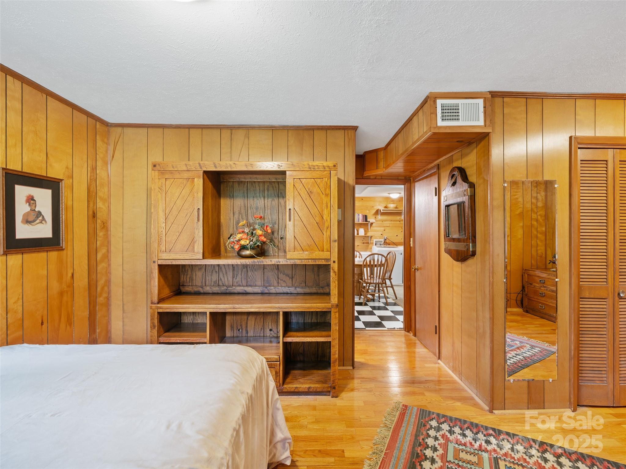 59 Deer Place Road Spruce Pine, NC 28777 - Photo 23 of 40 a bedroom with a bed and a mirror