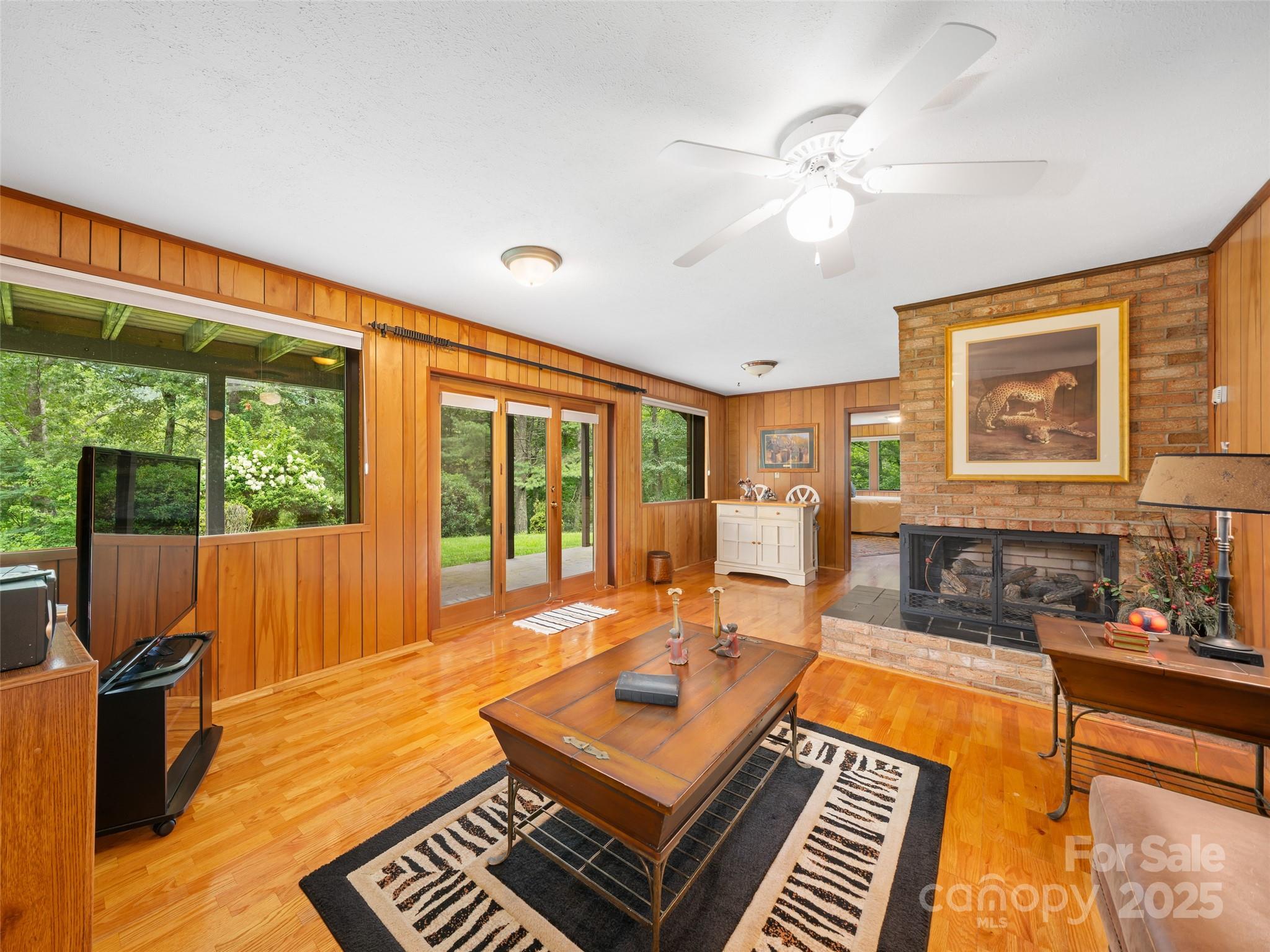 59 Deer Place Road Spruce Pine, NC 28777 - Photo 27 of 40 a living room with furniture and a floor to ceiling window