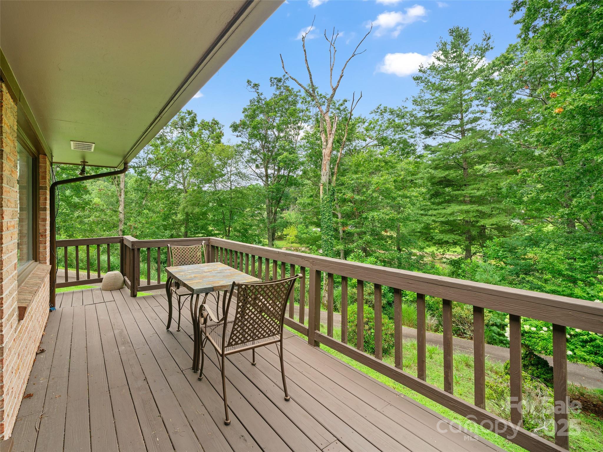 59 Deer Place Road Spruce Pine, NC 28777 - Photo 29 of 40 a view of a balcony with wooden floor and fence
