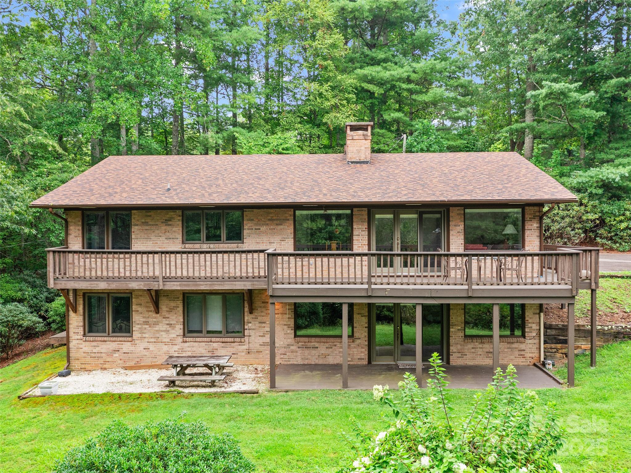 59 Deer Place Road Spruce Pine, NC 28777 - Photo 34 of 40 a view of a house with a yard and sitting area