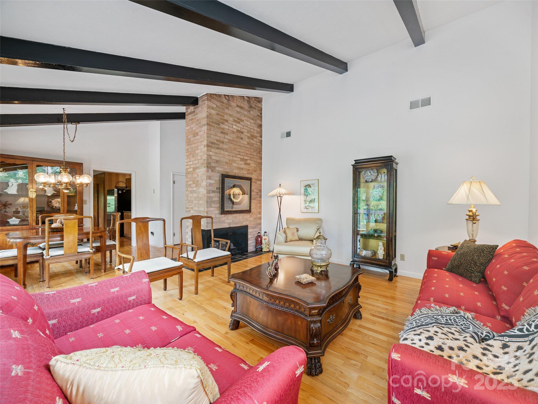 59 Deer Place Road Spruce Pine, NC 28777 - Photo 4 of 40 a living room with furniture or couch and a fireplace