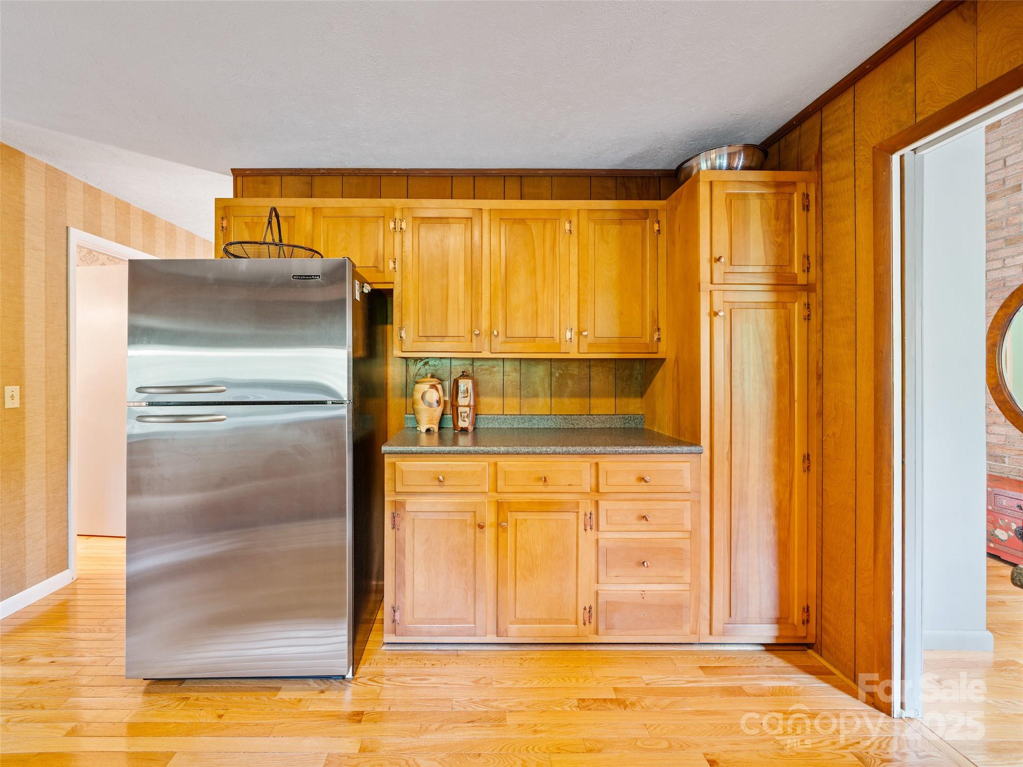 59 Deer Place Road Spruce Pine, NC 28777 - Photo 9 of 40 a kitchen with stainless steel appliances granite countertop a refrigerator and a stove