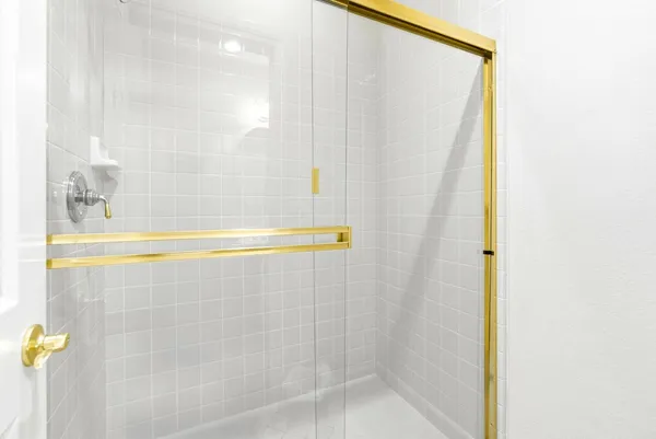 a bathroom with a toilet and a bath tub