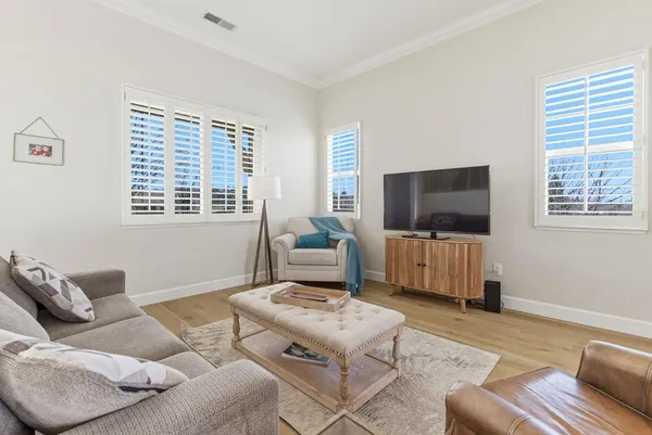 a view of a dining room with furniture window and wooden floor