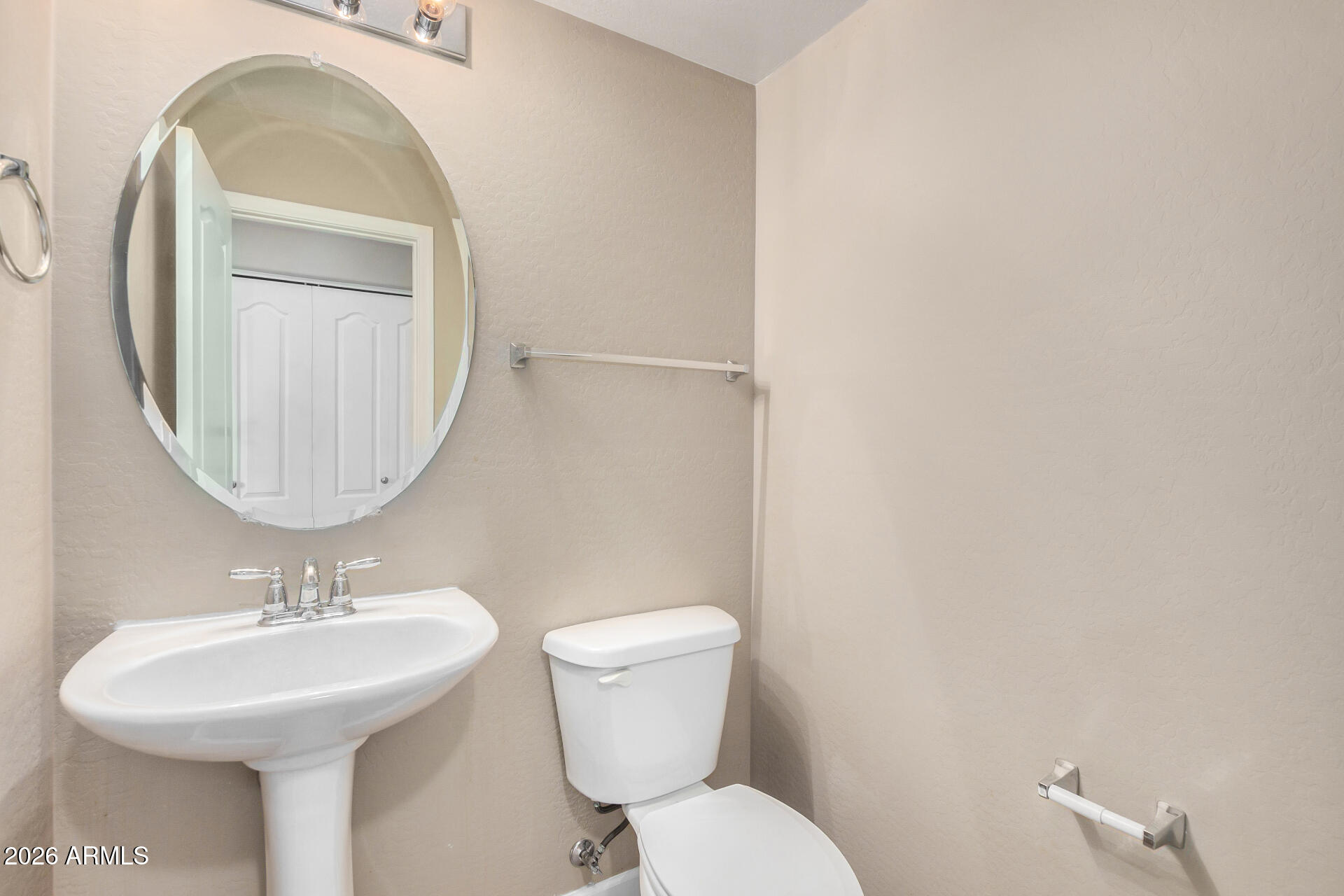 1784 South Seton Avenue Gilbert, AZ 85295 - Photo 11 of 27 a bathroom with a toilet sink and mirror