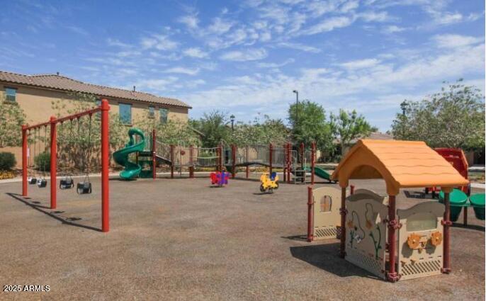 1784 South Seton Avenue Gilbert, AZ 85295 - Photo 27 of 27 a view of a house with entertaining space and a car parked