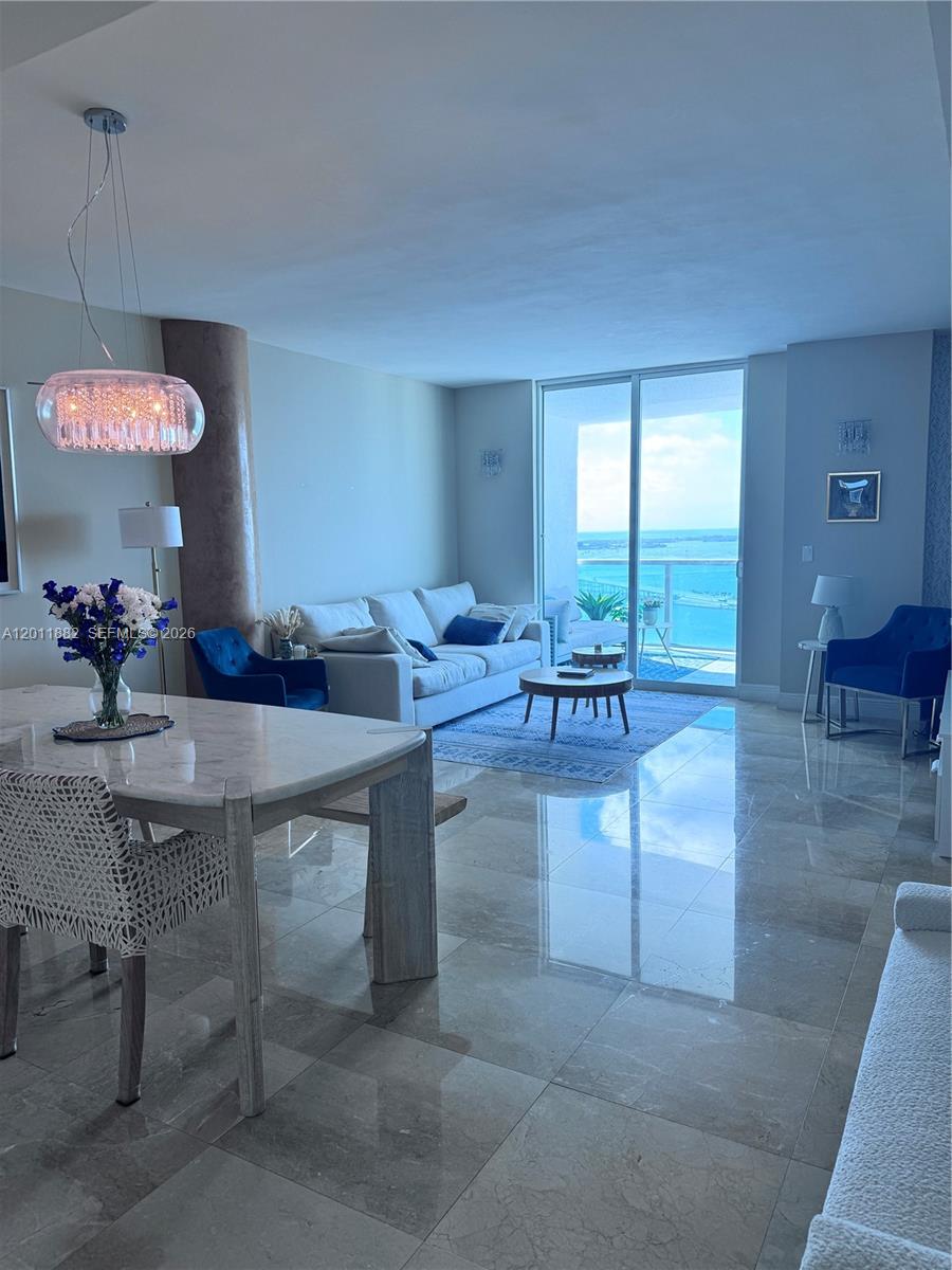 2101 Brickell Avenue, Unit 3205 Miami, FL 33129 - Photo 11 of 31 a view of a livingroom with furniture and a chandelier
