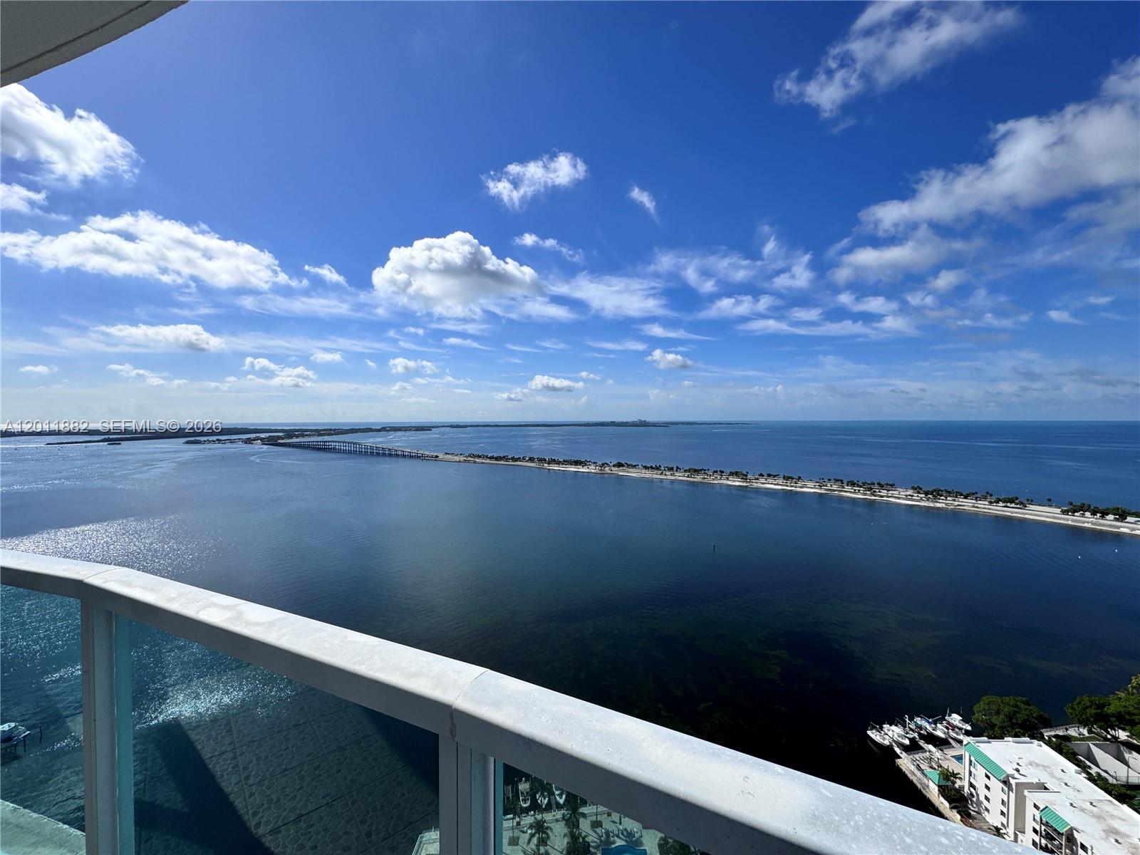 2101 Brickell Avenue, Unit 3205 Miami, FL 33129 - Photo 2 of 31 a view of a lake from a balcony