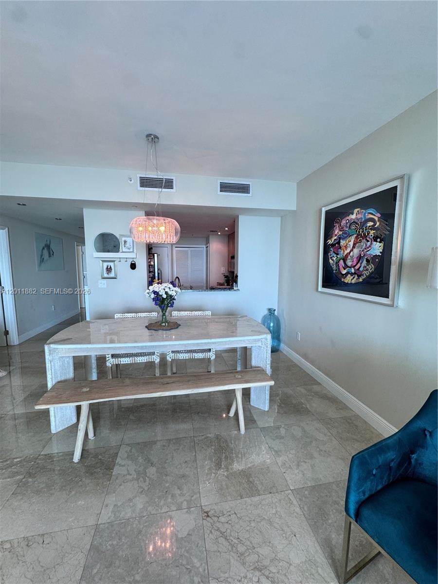 2101 Brickell Avenue, Unit 3205 Miami, FL 33129 - Photo 8 of 31 a living room with furniture and a table